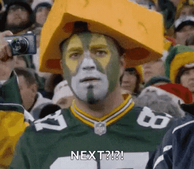 Green Bay Packers Fan In Cheese Hat And Face Paint GIF