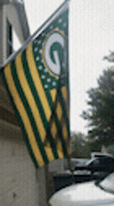 Green Bay Packers Flag Hanging From House GIF
