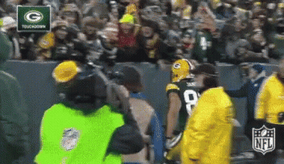 Green Bay Packers Player Escorted By NFL Security Guard GIF