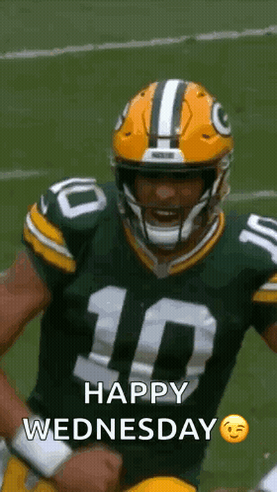 Green Bay Packers Player Holding Fist In Air With Helmet GIF