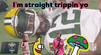Green Bay Packers Player Laying On Field With Baby And Mushroom GIF