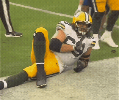 Green Bay Packers Player Laying On Ground GIF