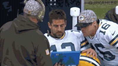 Green Bay Packers Player Number 18 Looking At Clipboard GIF