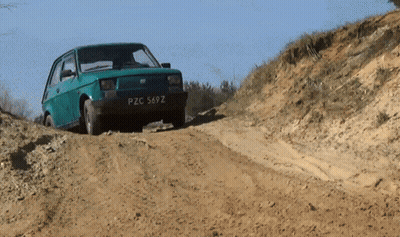 Green Car pzc569z Driving Dirt Road