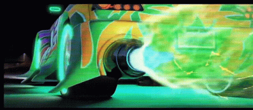 Green Car With Graffiti Driving Down Road GIF