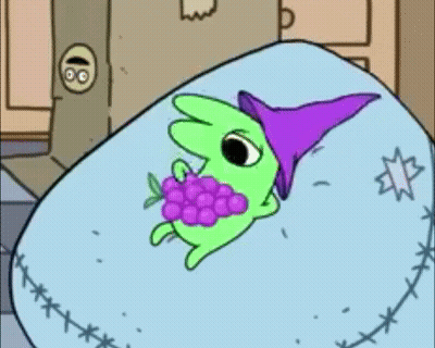 Green Cartoon Character In Purple Hat Eating Grapes GIF