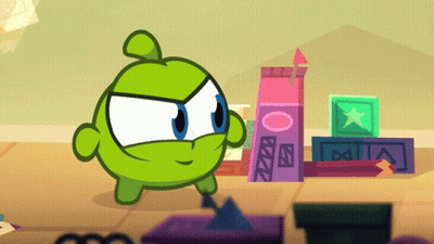 Green Cartoon Character Standing In Front Of Letter A Blocks GIF