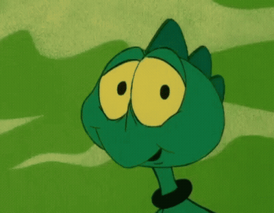 Green Cartoon Character With Big Yellow Eyes GIF