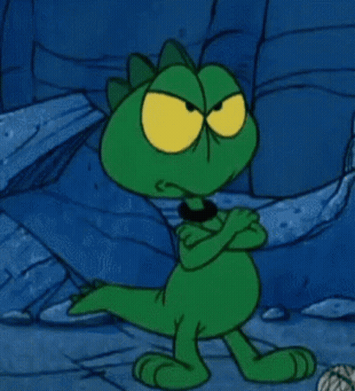 Green Cartoon Character with Yellow Eyes Arms Crossed
