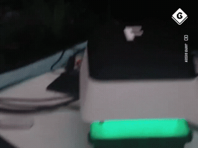 Green Cell Phone Next To Laptop And Sign Saying G GIF