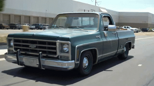 Green Chevy Truck Parked In Front Of Building Number 1234 GIF