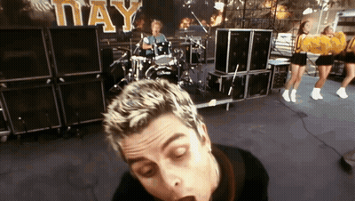 Green Day Performing With Cheerleaders GIF