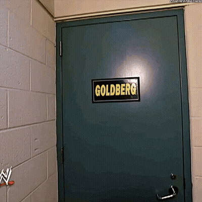Green Door With Goldberg Sign GIF