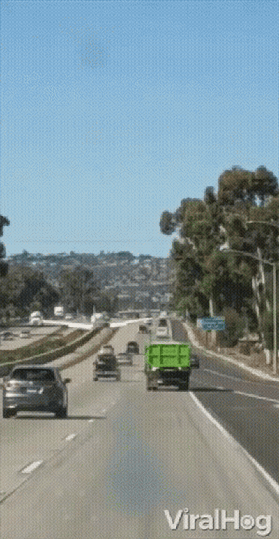 Green Dump Truck On Highway With Viralhog Sign GIF