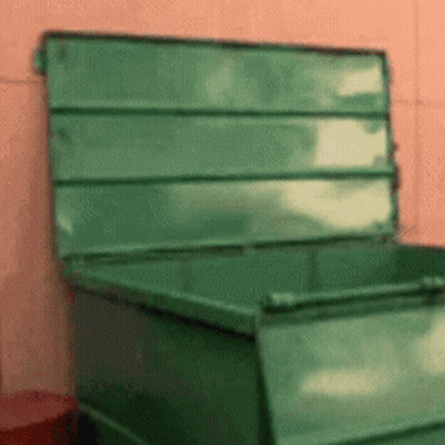Green Dumpster With Open Lid On Pink Wall GIF