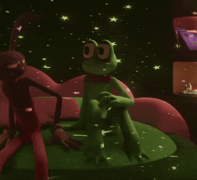 Green Frog In Red Bow Tie Sitting On Couch GIF