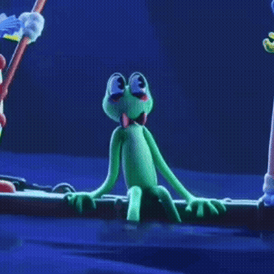 Green Frog With Bow Tie Sitting On Log GIF