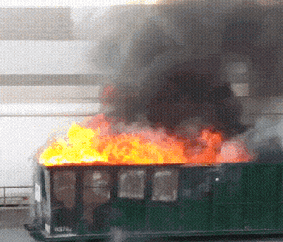 Green Garbage Can On Fire With Number 03764 GIF