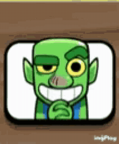 Green Goblin Smiling On Wooden Table GIF