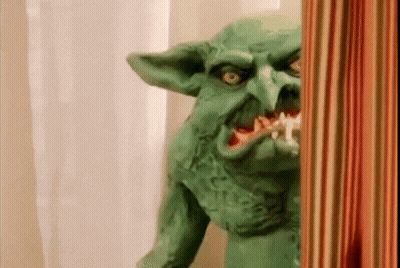 Green Goblin Statue With Toothbrush GIF