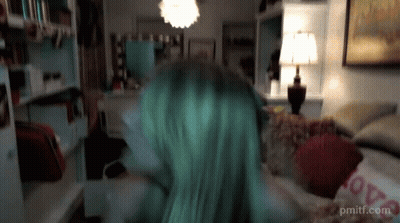 Green Hair Woman On Couch With Love Pillow GIF