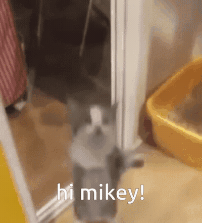 Green Haired Man Drinking From White Cup GIF