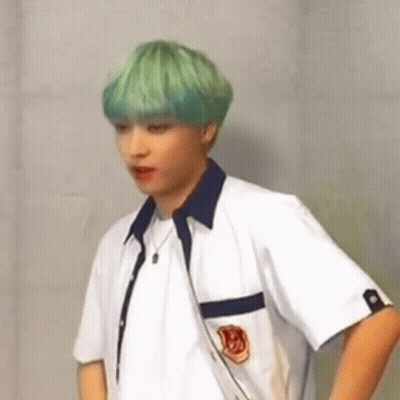 Green-Haired Man White Shirt Hands On Hips GIF