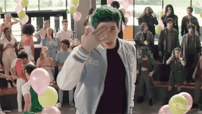 Green Haired Person Standing Before Crowd GIF