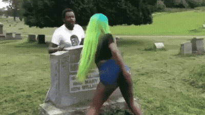 Green-Haired Woman Dancing At Grave In Cemetery GIF