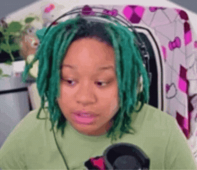 Green-Haired Woman In Green Shirt And Headphones GIF