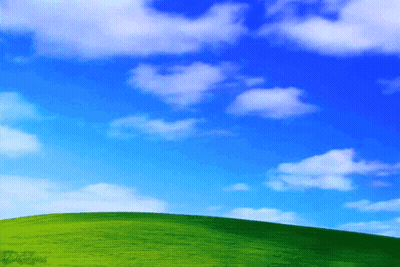 Green Hill With Blue Sky And White Clouds GIF