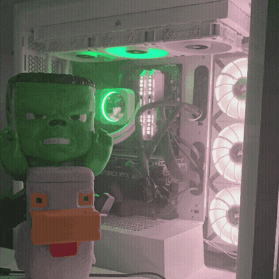 Green Hulk Figurine In Front Of Corsair RTX 30 Motherboard GIF