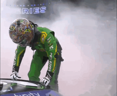 Green-Jacketed Man With Helmet Beside Car Saying Ries GIF