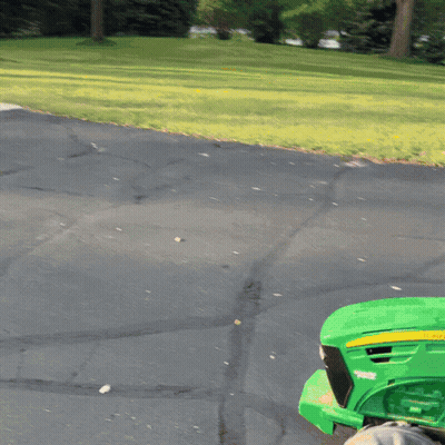 Green John Deere Tractor Parked On Road GIF
