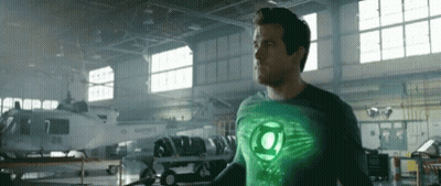 Green Lantern Costume Man in Hangar With Helicopter