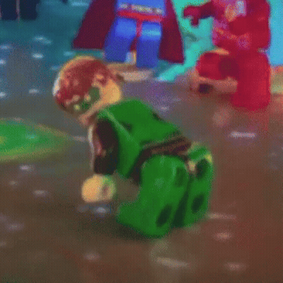 Green Lego Figure Crawling In Video Game GIF