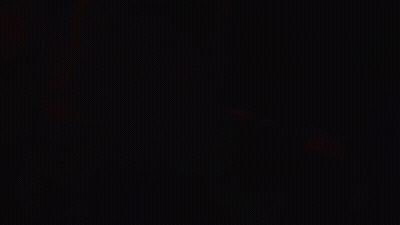 Green Light Shining Through Dark Room GIF
