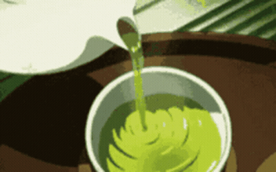 Green Liquid Pouring Into White Cup GIF