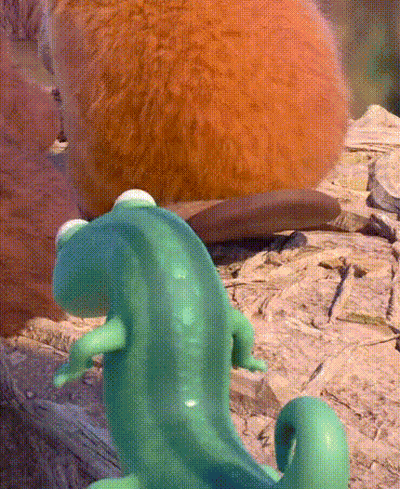 Green Lizard Sitting On Rock Next To Squirrel GIF