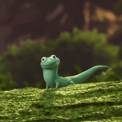 Green Lizard Standing On Mossy Hill GIF
