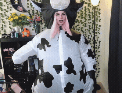 Green Mascot In Number 1 Shirt Dancing On Baseball Field GIF