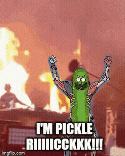 Green Pickle Sitting Next To Pencil GIF