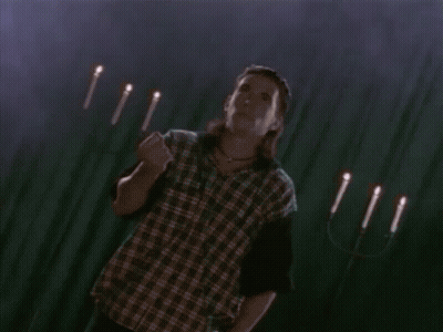 Green Power Ranger Standing In Front Of Dark Background GIF