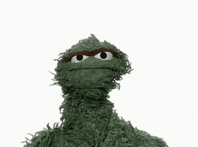 Green Sesame Street Character Holding Scram Sign GIF