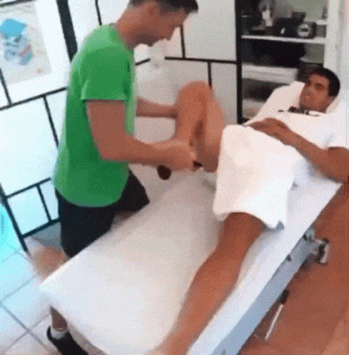 Green Shirt Kneeling Next To White Shirt Laying GIF