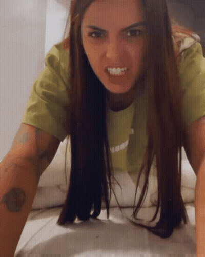 Green Shirt Woman Crawling On Bed Mouth Open GIF
