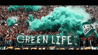 Green Smoke Coming Out Of A Crowd With A Green Banner That Says Green Life GIF