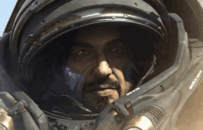 Green Space Ship Flying Above Clouds GIF