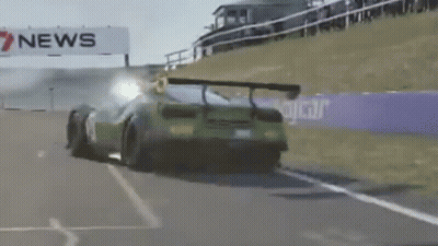 Green Sports Car On Race Track With 7 News Sign GIF