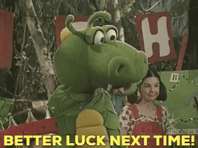 Green Stuffed Animal Saying Better Luck Next Time